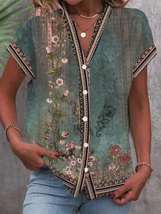 Blusa holgada de manga corta con escote en V y diseño floral