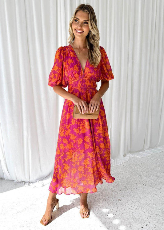 Vestido midi floreado de caída fluida con escote en V y mangas abullonadas